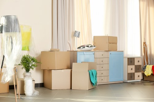 Man with van loading furniture for a local move in Gidea Park