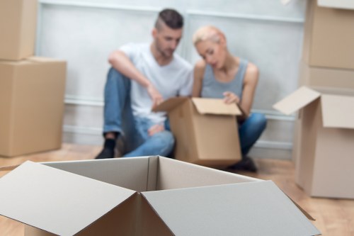 Careful wrapping of fragile household items during a packing service