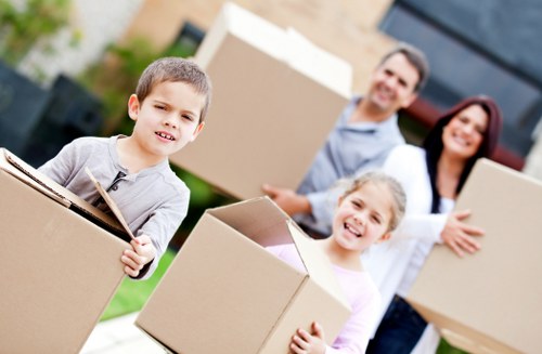 Careful loading of boxes and furniture into a removal van