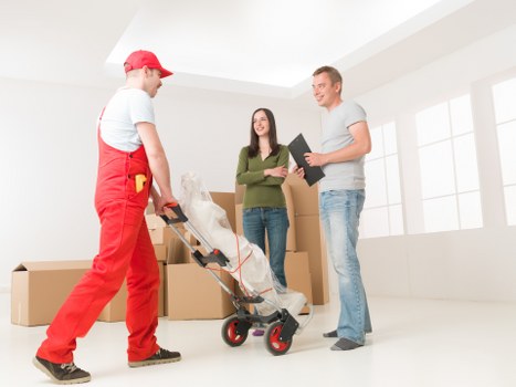 Careful handling of boxes and household items during removal