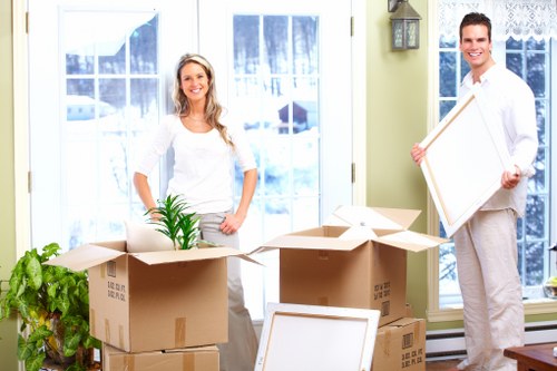 Organised office boxes and workstation items prepared for relocation