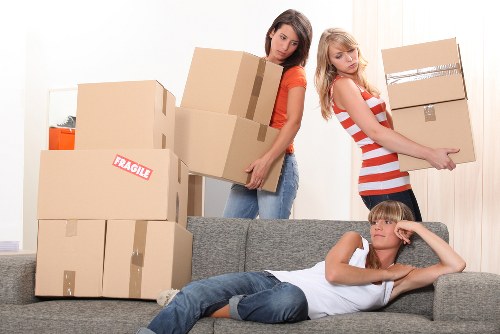 Professional movers handling furniture for a Gidea Park house relocation