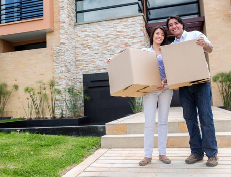 Trained movers handling furniture with proper lifting technique and care