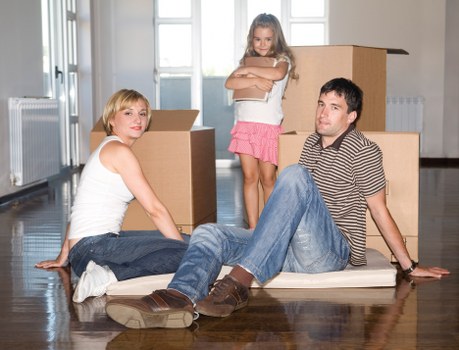 Removal vehicle loading household items for a local move